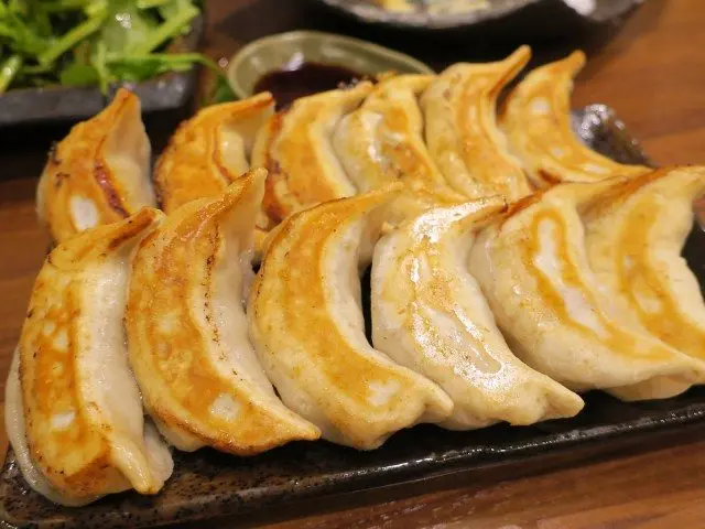 Enjoy scrumptious gyozas and drinks at Dandadan Sakaba in Tokyo!