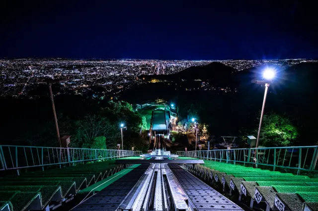 The powerful ski jump and the beautiful night view of Sapporo