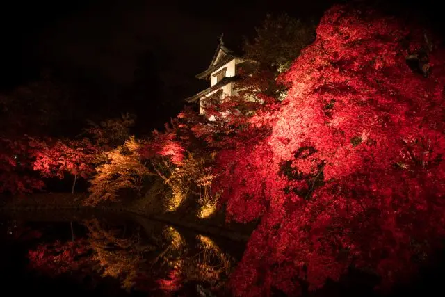 Hirosaki Castle amidst deep crimson foliage