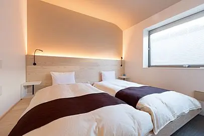 Relax in the rooms, filled with soft indirect lights and beautiful wood-grained finishes