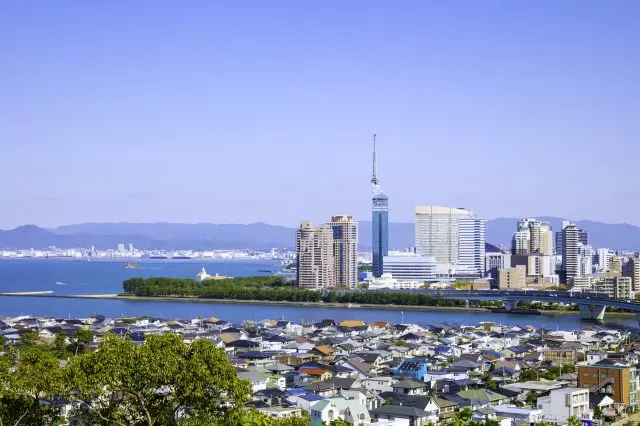 The cityscape of Fukuoka, surrounded by warm seas and a mild climate.