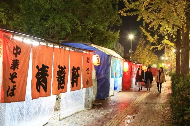 Food stalls line Kuramoto-Dorii at night. It is recommended to eat from one stall to another!