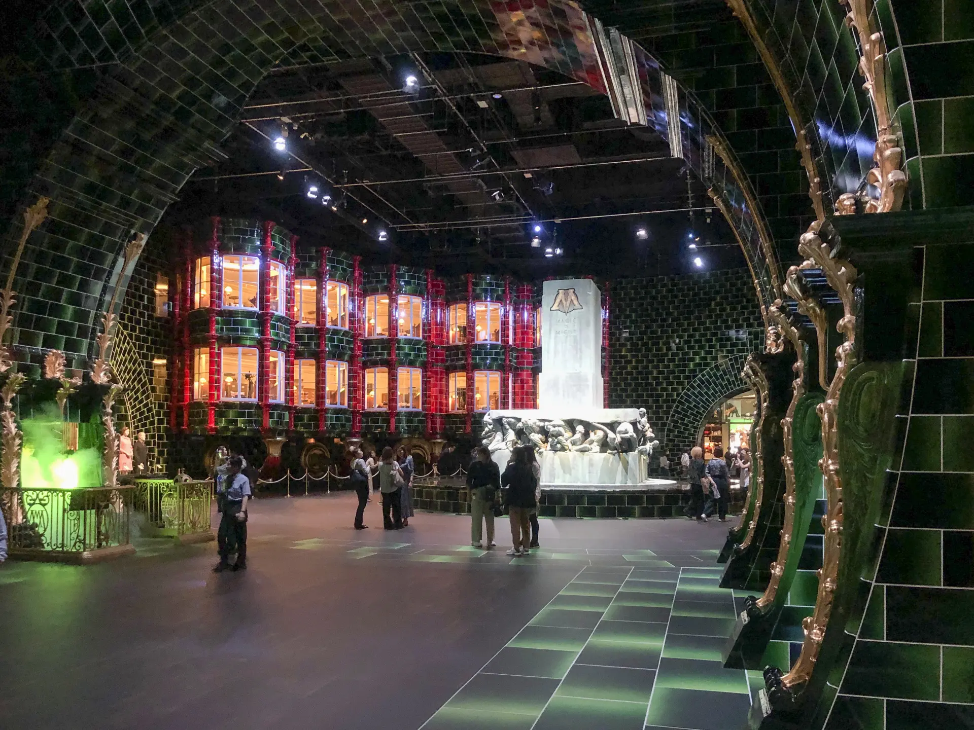 Offices in the back left, Magic is Might statue at the front