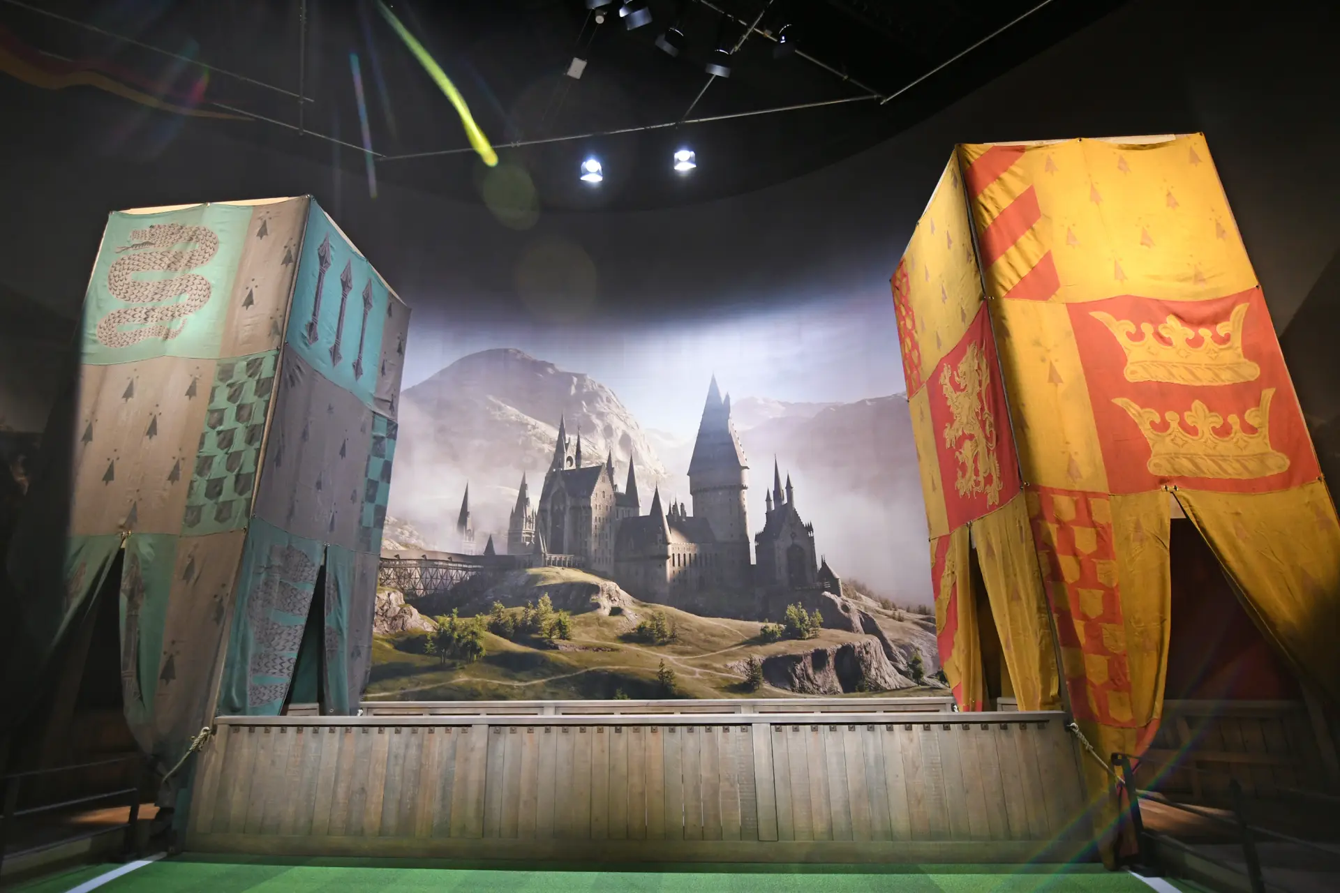 Lineup along the spectator seats and cheer for Slytherin or Gryffindor