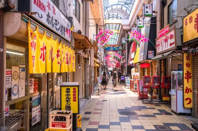 Explore nostalgic alleyways that capture the retro charm of old Osaka.
