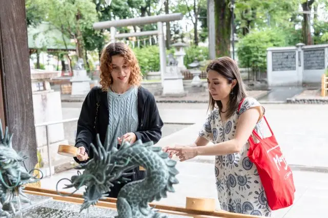Before paying respects, you can purify your body and mind at the temizuya (water purification pavilion). Your guide will teach you the etiquette for it.