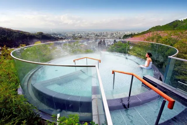 Swooping views out over Aizu-Wakamatsu from the open-air bath at Onyado Toho.