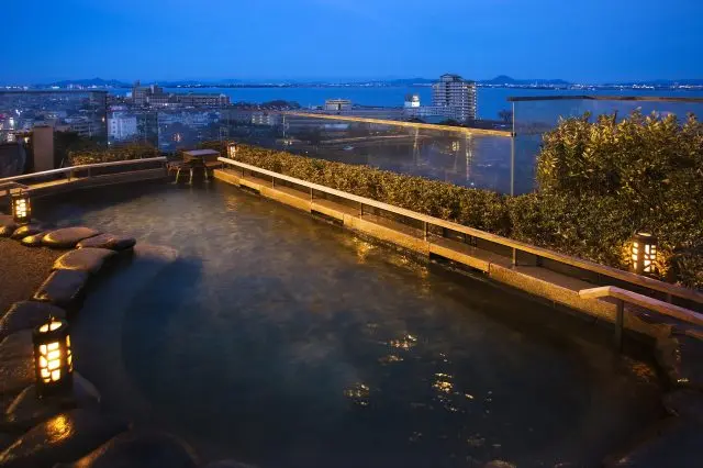 Take in the vast view of Lake Biwa while enjoying a soak.