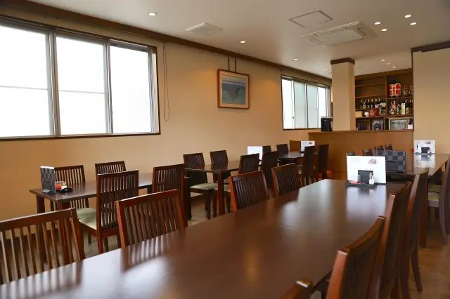 Table seating and private rooms for groups await inside (please confirm by phone beforehand for a private room).