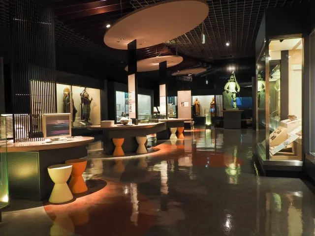 A colorful repertoire of Gify City artifacts at the exhibition hall, including pottery from the prehistoric era and Buddhist statues.