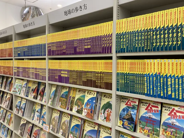 The cover features a vivid yellow background and a richly detailed illustration.