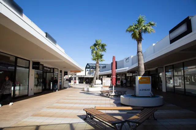 The urban-themed zone features high-end brands.