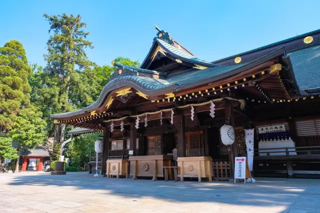 A solemn atmosphere surrounds the haiden (worship hall) of Okunitama-jinja Shrine