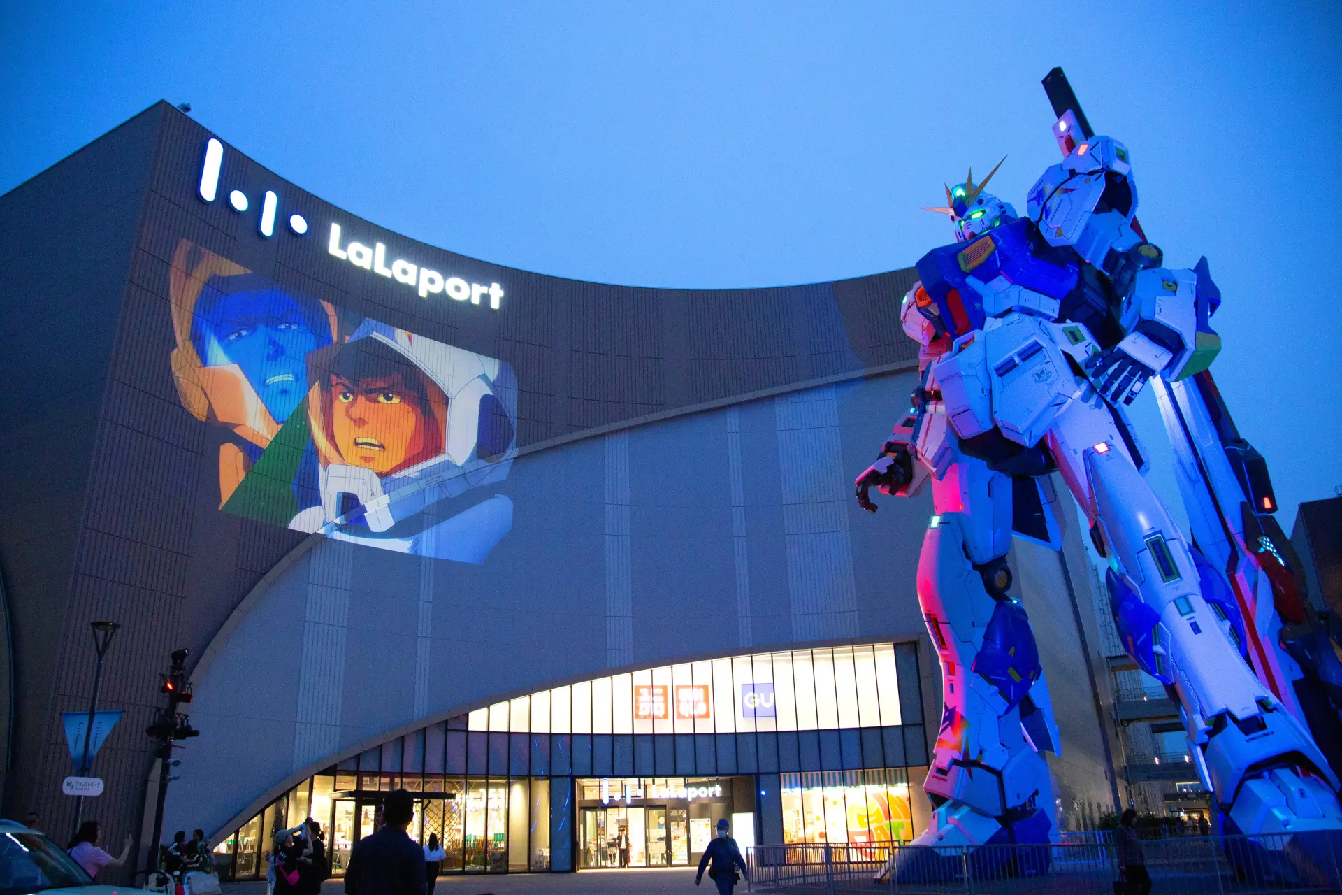 The special nighttime performance is projected onto the building’s exterior walls.
