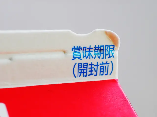 A milk carton with a small dent