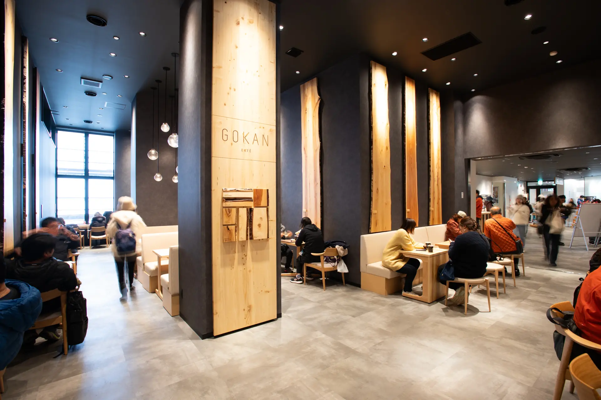 The tables and chairs are made by the Hida furniture manufacturer Nissin Mokko.