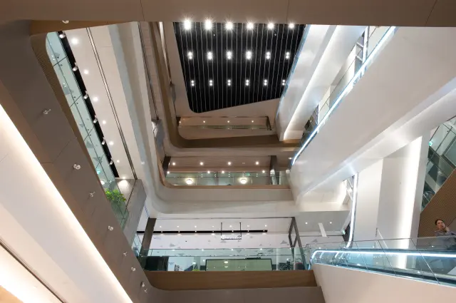 A large atrium welcomes visitors as they enter the building.