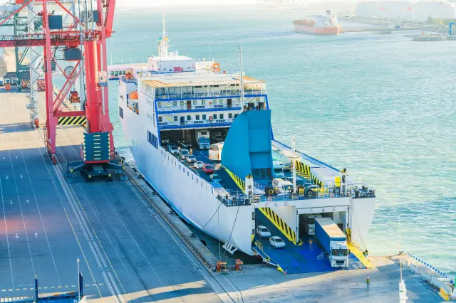 A ferry is a ship that carries and transports cars.