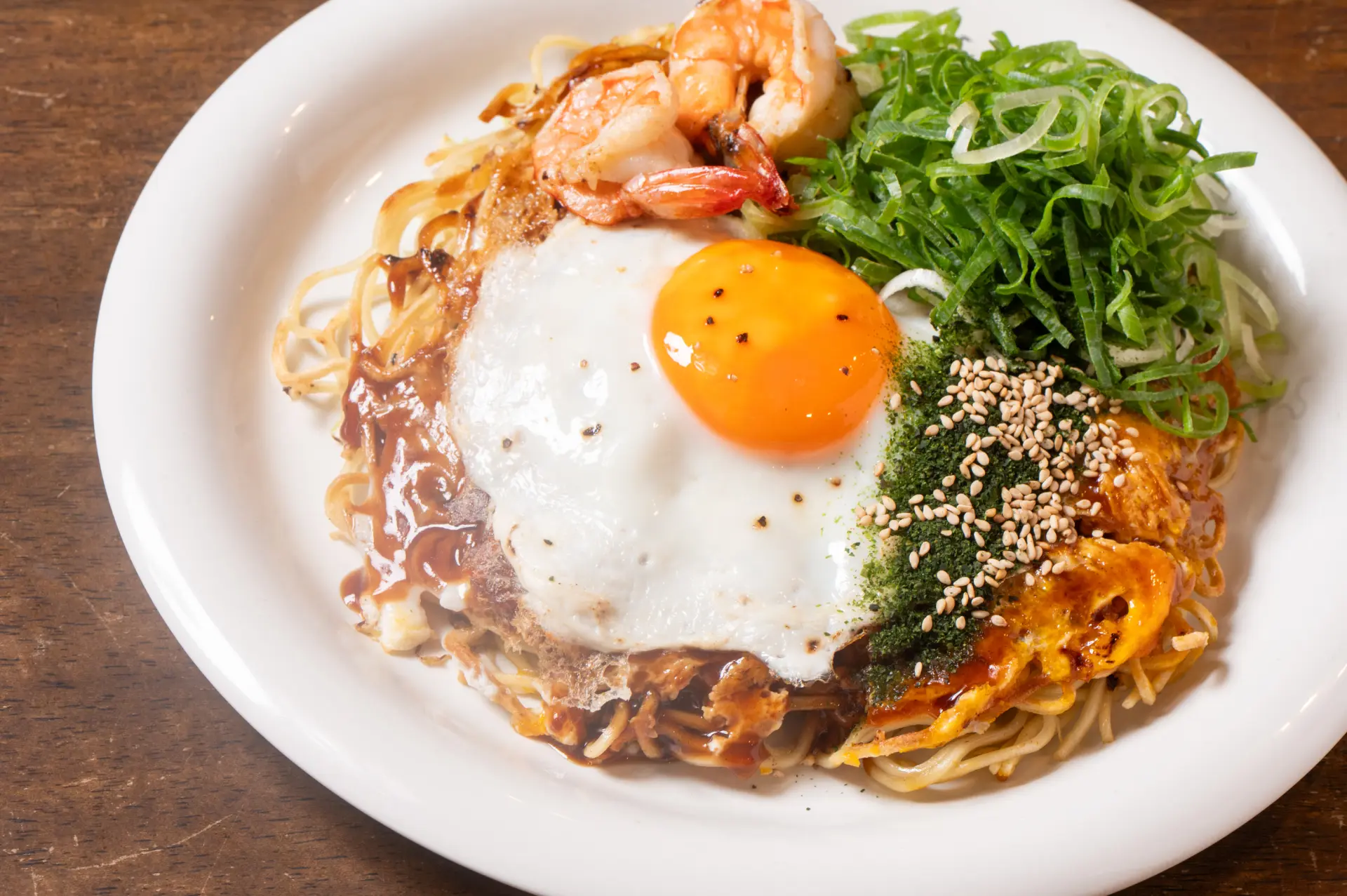 Hiroshima-style okonomiyaki is characterized by the addition of noodles.