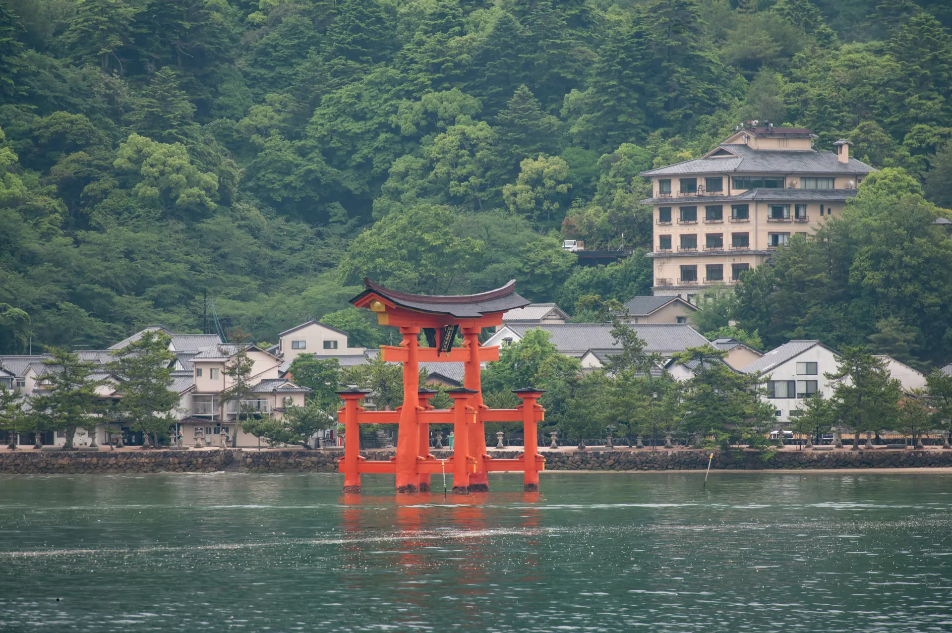 The Great Torii Gate and Miyajima townscape viewed from the ferry