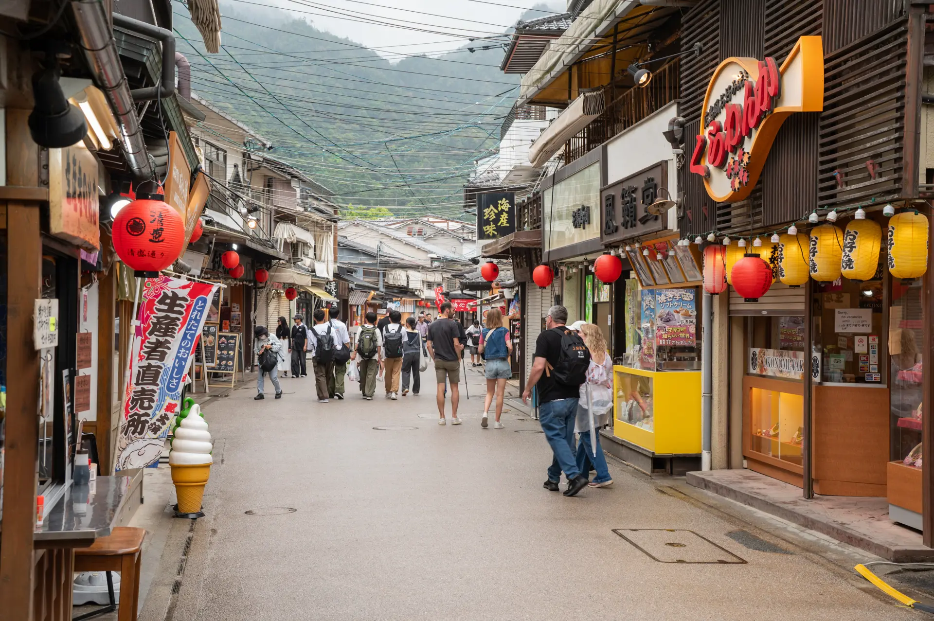 The shopping street, bustling with visitors, feels like a festival.