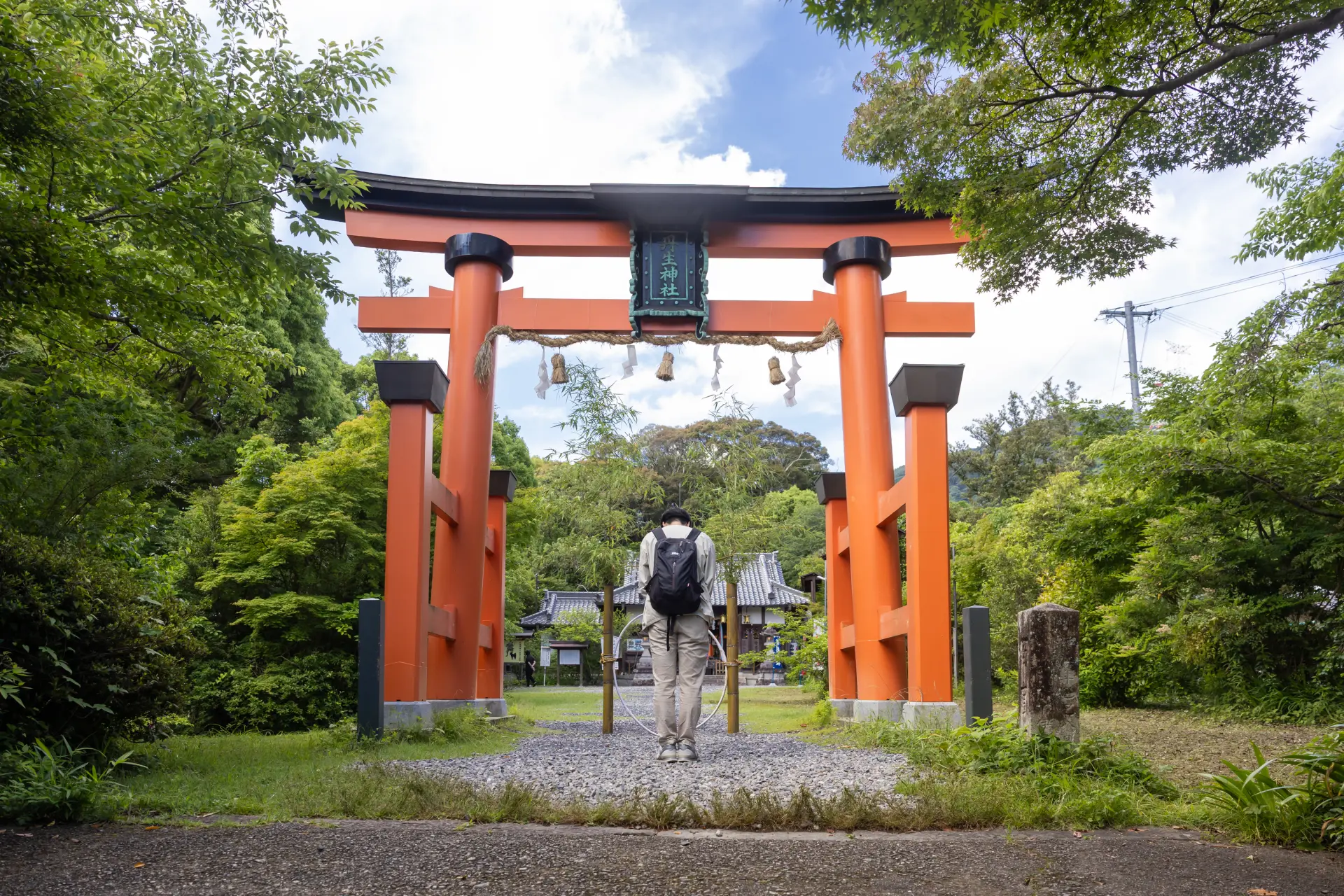 A large torii gate greets visitors at the top of the steps from Jison-in Temple. Bow once before passing through it.
