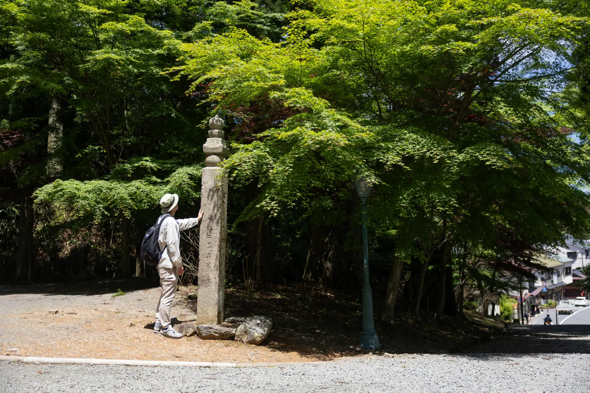 Check the choishi stone marker beside Dai-mon Gate before continuing toward central Koyasan.