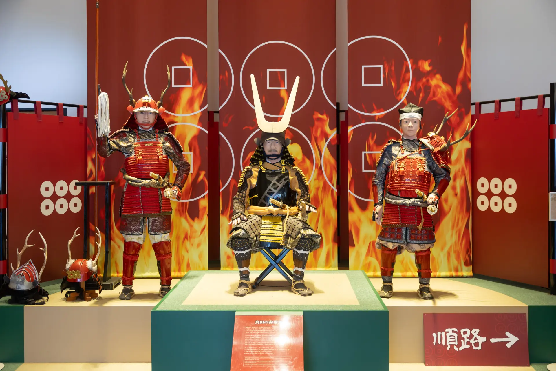 Three generations of the Sanada family-Masayuki, Yukimura, and Daisuke-welcome visitors at the entrance.