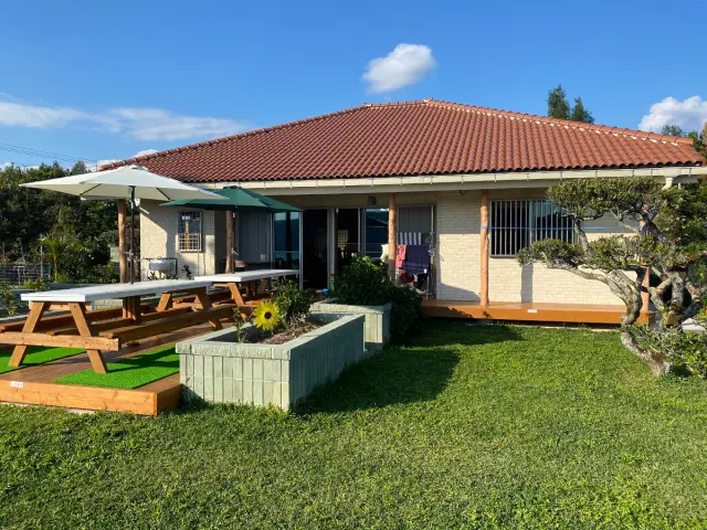 A relaxing space with a spacious wood deck and garden