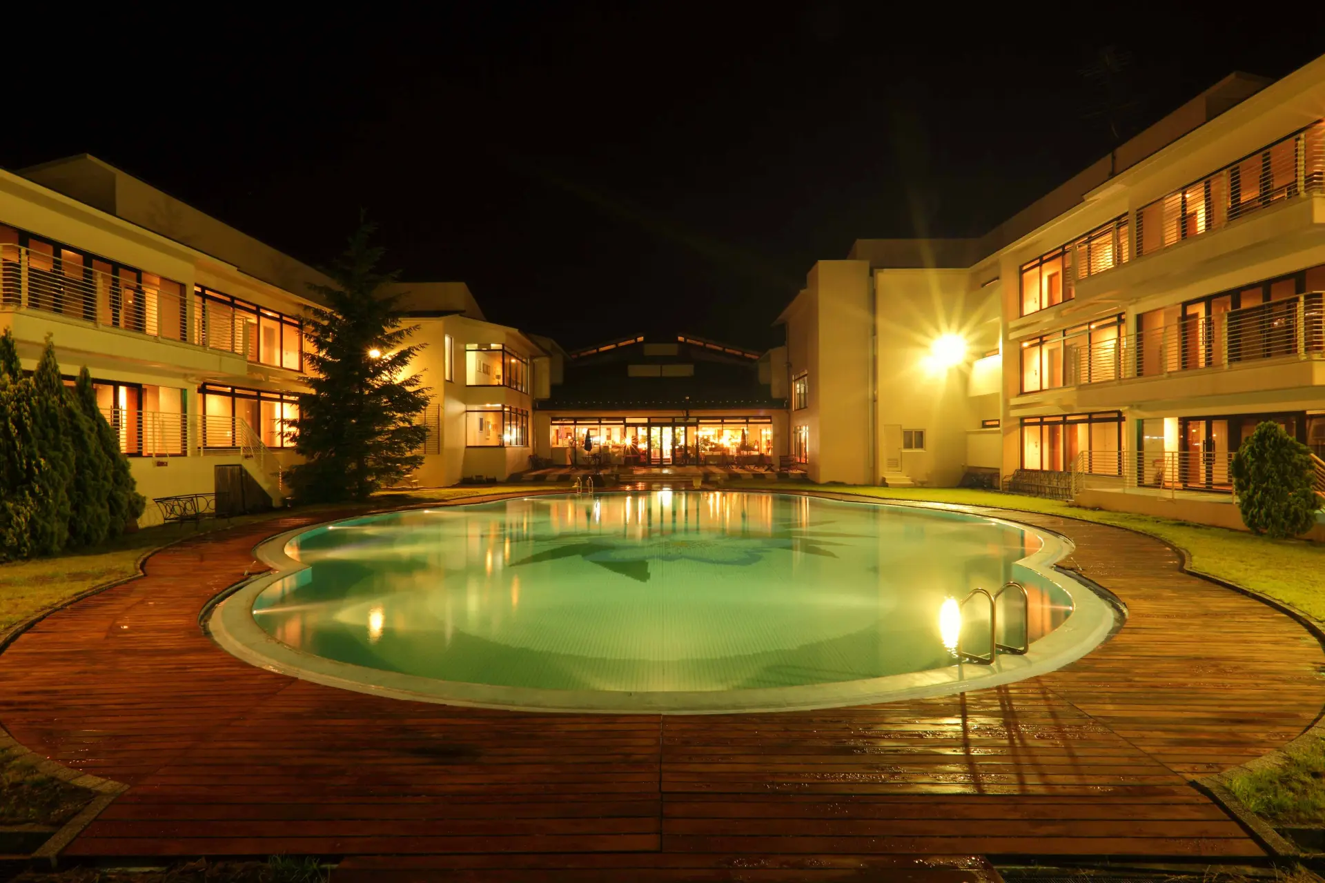 The illuminated pool adds to the resort atmosphere at Oriental Garden