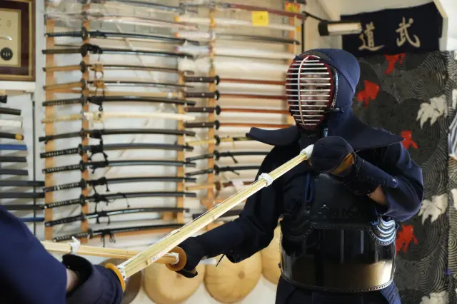 Kendo practitioners face each other with shinai