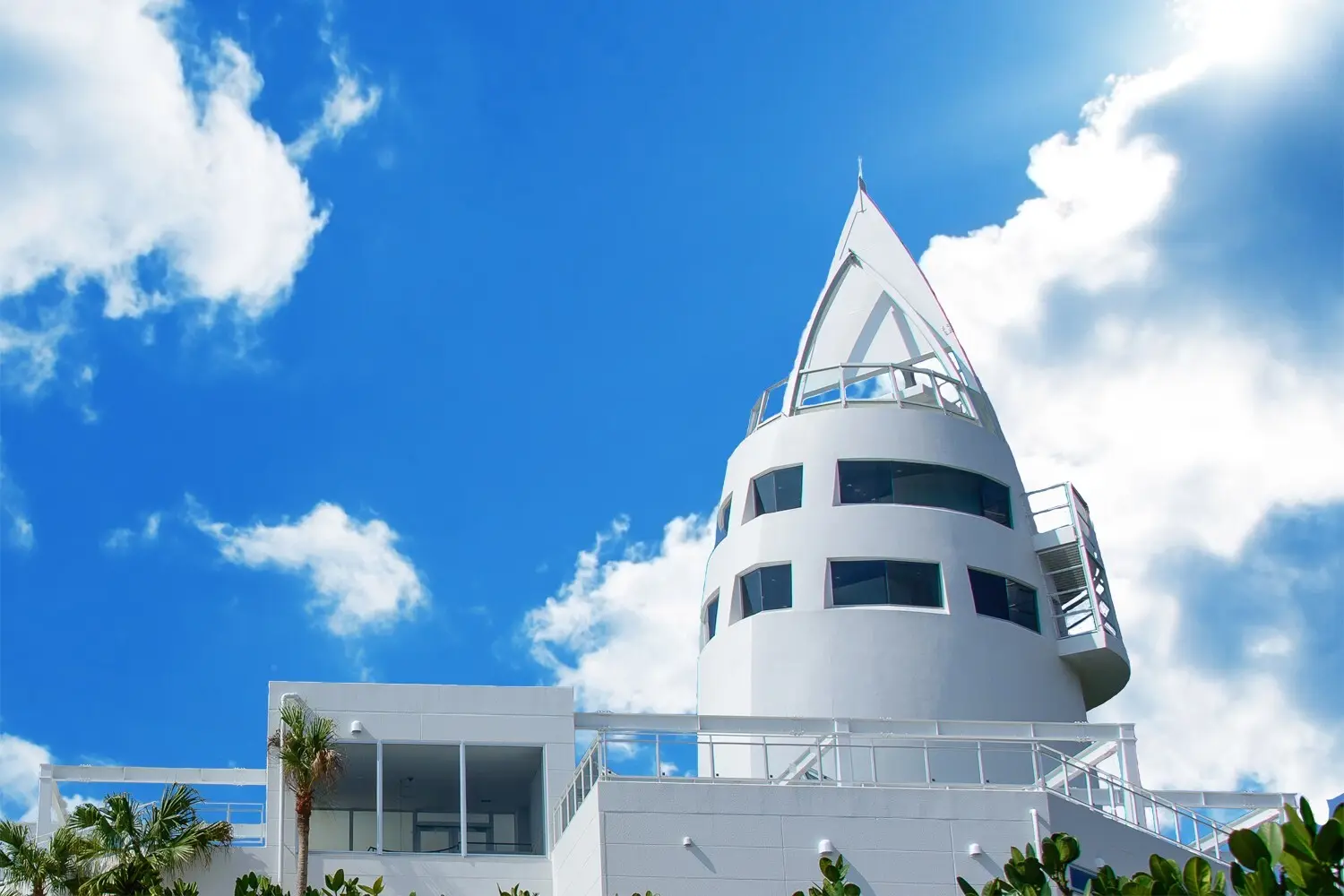 The tower’s white exterior against a blue sky