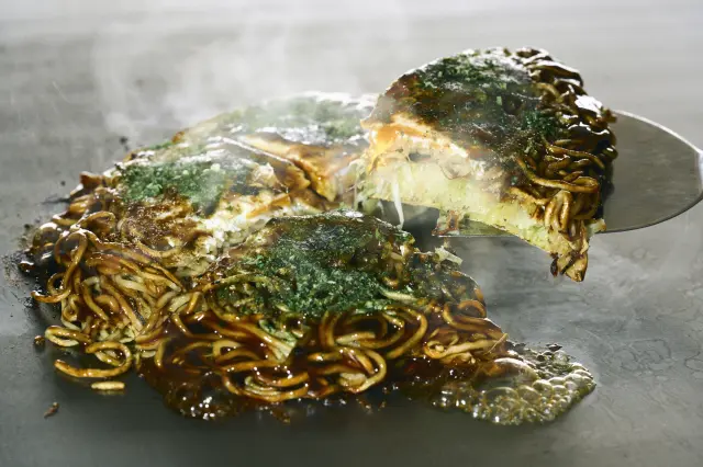 Visitors can also savor okonomiyaki, a local favorite among Hiroshima residents