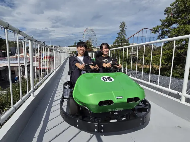 Drive while enjoying views of the amusement park