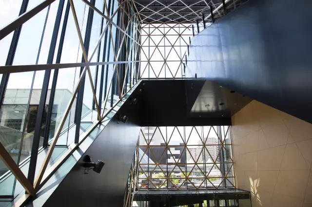 An atrium featuring beautiful geometric latticework with a wood-grain finish